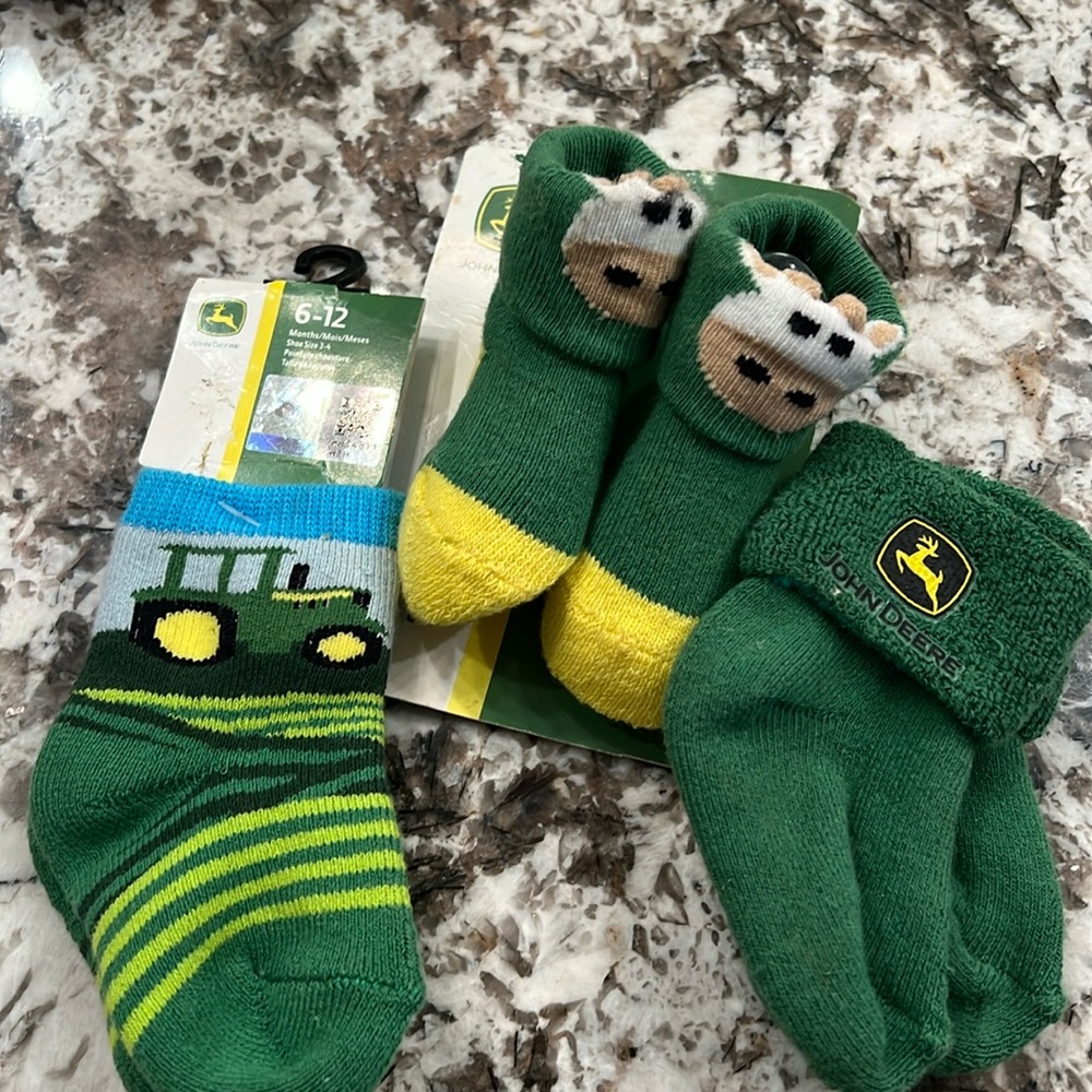 John Deere 0-6 newborns booties and two pairs of John Deere green socks 6-12 M